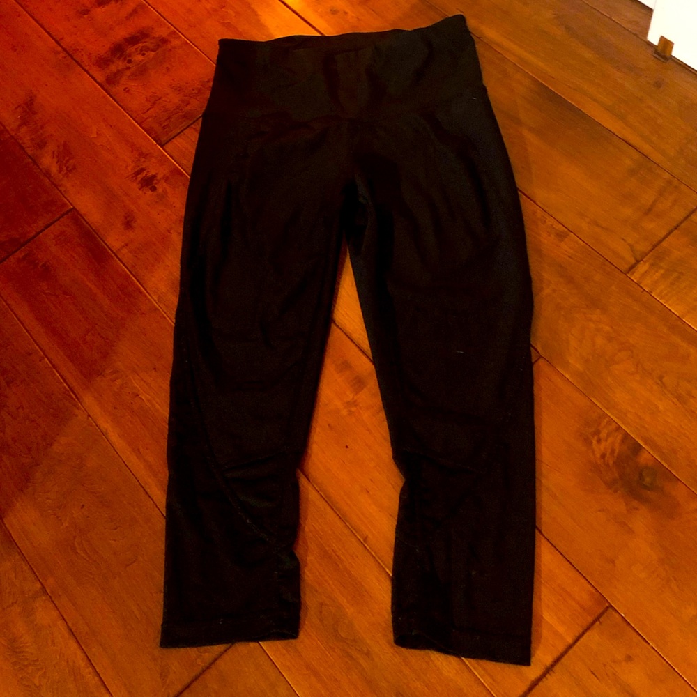 Black capri leggings with mesh bottom